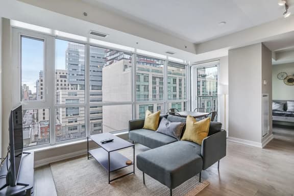 High-Floor Downtown 1BR+Den | City Views